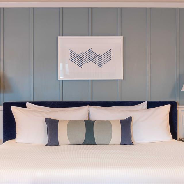 Bed with decorative throw pillow