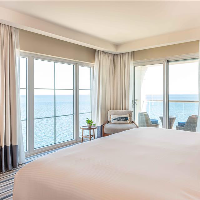 Corner bedroom with an ocean view