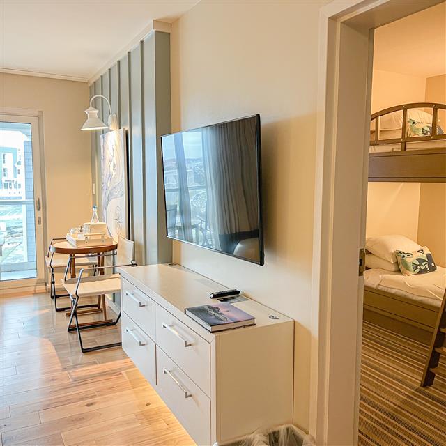 Living area with peek into bunk bed room