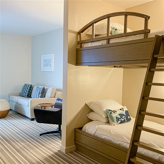 Bunk beds with a small living area