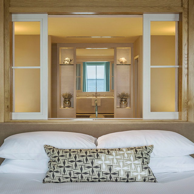 Bedroom with view into bathroom