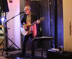 Man Playing a Guitar