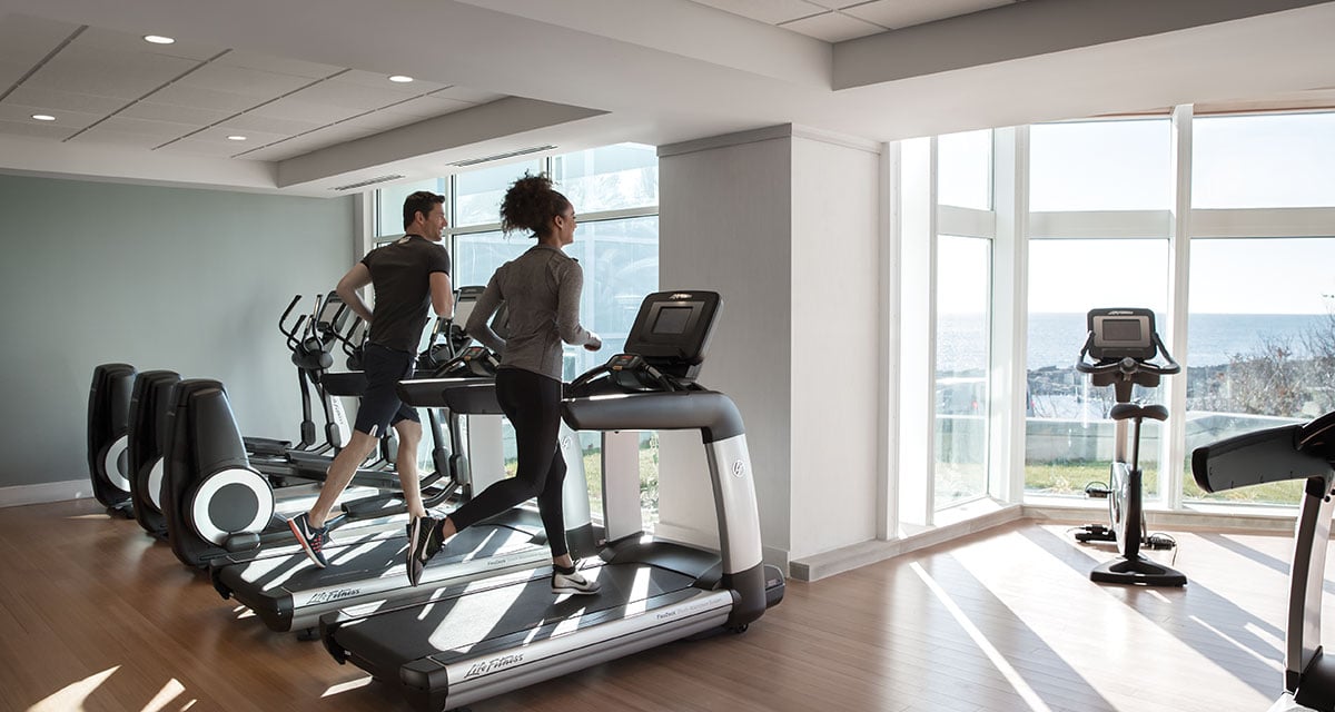 Running on Treadmills in Fitness Center